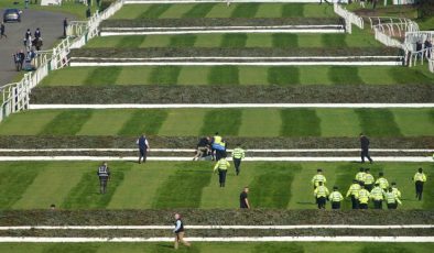 Start of Grand National delayed as protesters forcibly removed from racecourse