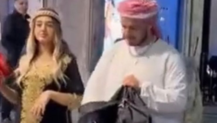 Arap kıyafeti giyip ellerindeki paraları etrafa saçan 2 kişiden 1’i yakalandı