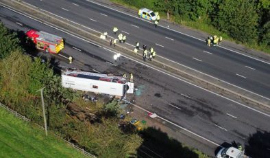 Girl, 14, and driver killed after school bus overturns on motorway
