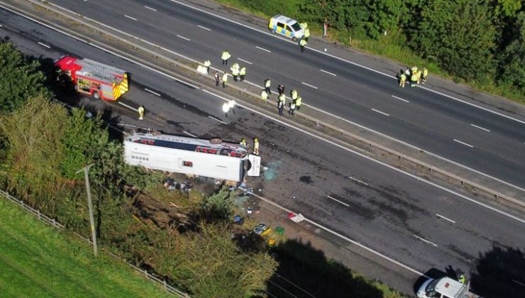Girl, 14, and driver killed after school bus overturns on motorway