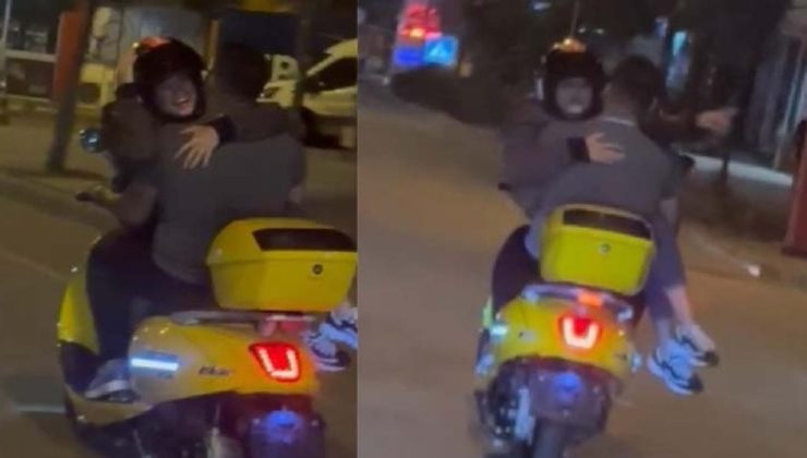 Trafikte tehlikeli hareketler: Kız arkadaşını kucağında taşıdı