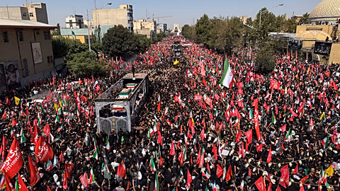 Ali Khamenei’s coffin passes through thousands of mourners in Iraq’s holy city of Najaf